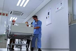 preparation for an operation through vinshealth male nurse with a stretcher to the operation room