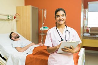 find a reliable icu at vinshealth ICU with patient relaxing bed and nurse with a checklist