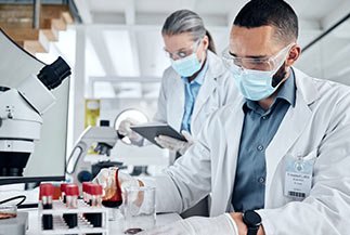 laboratory assistants working together for human sample test